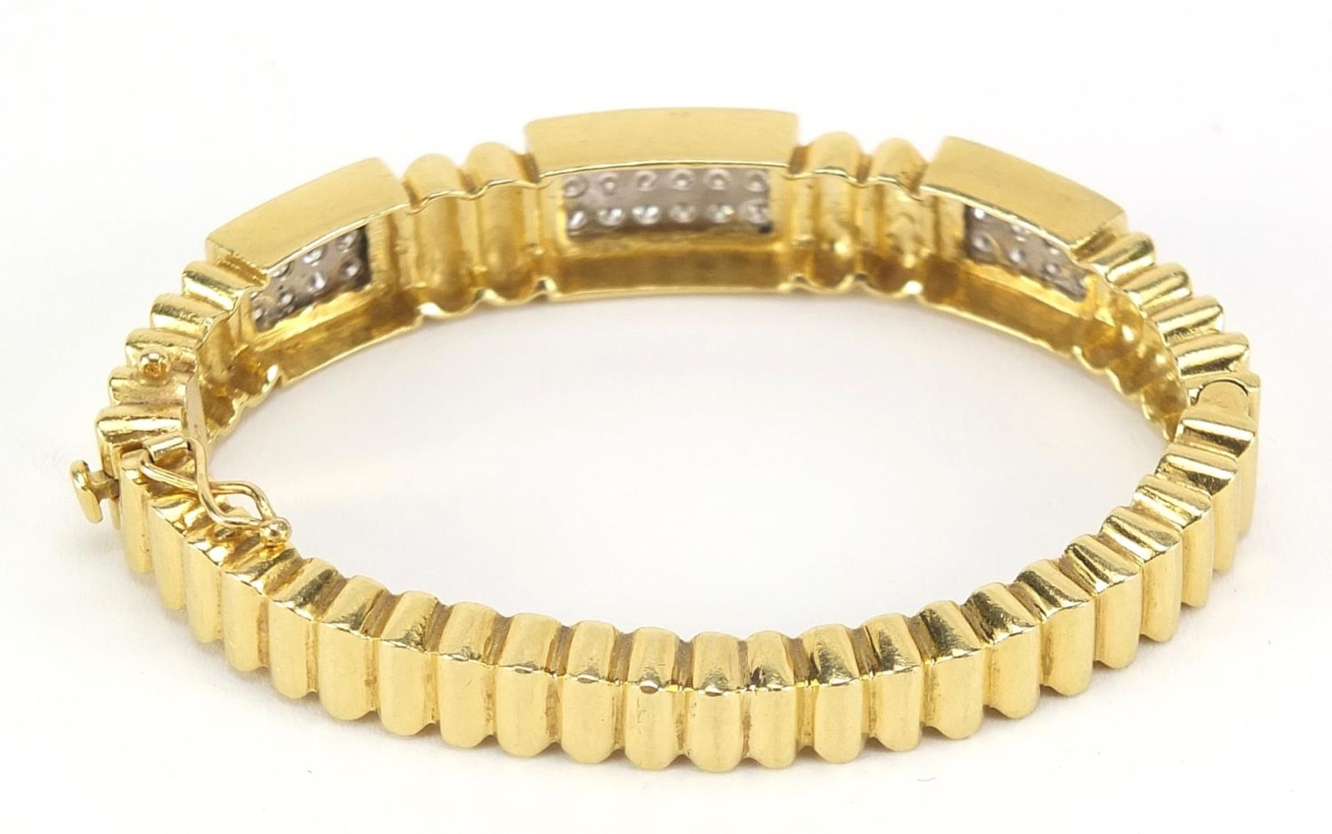 18ct gold diamond cluster hinged bangle, set with forty two diamonds the diamonds approximately 2. - Image 3 of 7