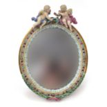 19th century Continental porcelain easel mirror surmounted with two cherubs, 34cm x 25cm : For
