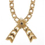 9ct gold bow design necklace set with a sapphire, 38cm in length, 22.4g : For Further Condition