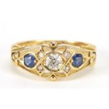 Edwardian 18ct gold diamond and sapphire ring with pierced ornate setting, the central diamond