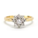 Unmarked gold diamond cluster ring, the central diamond approximately 3mm in diameter, size L, 3.