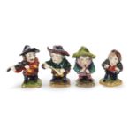 Four Crown Derby style hand painted porcelain dwarf musicians, the largest 9cm high : For Further