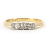18ct gold and platinum graduated diamond five stone ring, the central diamond approximately 2.3mm in