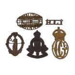 Five military interest cap badges including Royal Corps of Signals and Royal Army Ordinance