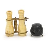 Two Stanhopes comprising bone binoculars with landmark buildings and bog oak cauldron with