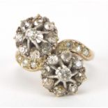 Antique unmarked gold diamond cluster crossover ring, the larger diamonds approximately 2.8mm in