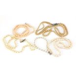 Four pearl and simulated pearl necklaces and bracelet including one with 9ct gold clasp and four