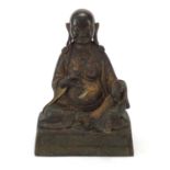 Chino-Tibetan partially gilt bronze figure of seated Buddha, 25cm high : For Further Condition