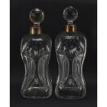 Matched pair of hour glass decanters including one with silver collar by Elkington & Co, each 28cm