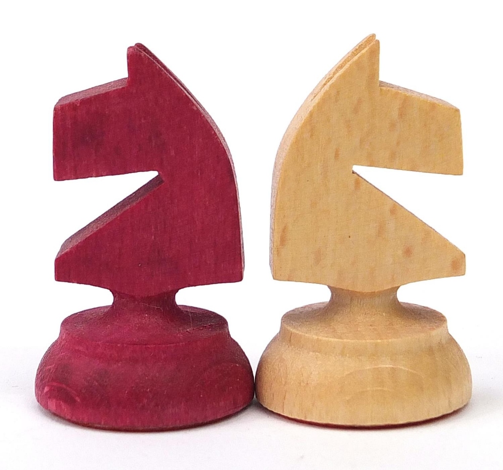 Carved wood half stained chess set with fitted folding chess board, the largest pieces each 6.5cm - Image 6 of 10