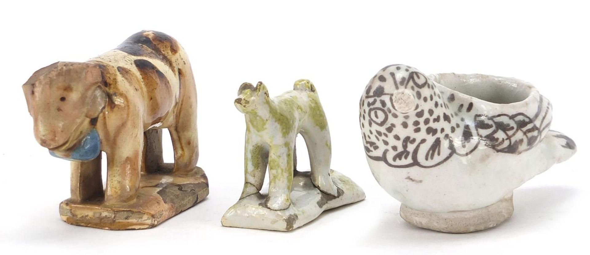 18th century and later ceramics including a dog whistle and cow, the largest 10.5cm in length :