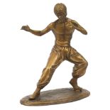 Gilt painted bronze figure of Bruce Lee, 35cm high : For Further Condition Reports Please Visit