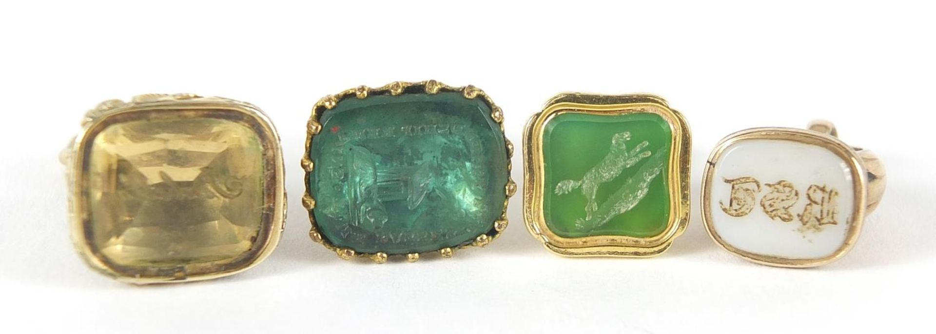 Four Georgian and later unmarked gold and gold coloured metal intaglio seal fobs, the largest 2. - Image 3 of 6