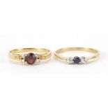 Two unmarked gold rings set with diamonds, sapphire and garnet, sizes L and N, total 3.7g : For