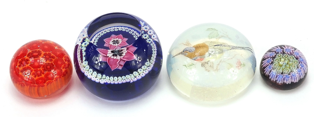 Four colourful glass paperweights including Caithness, Whitefriars Anemone and an opalescent bird