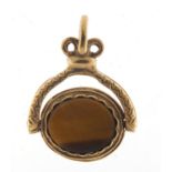 9ct gold black onyx and tiger's eye spinner fob, 2.4cm high, 4.5g : For Further Condition Reports