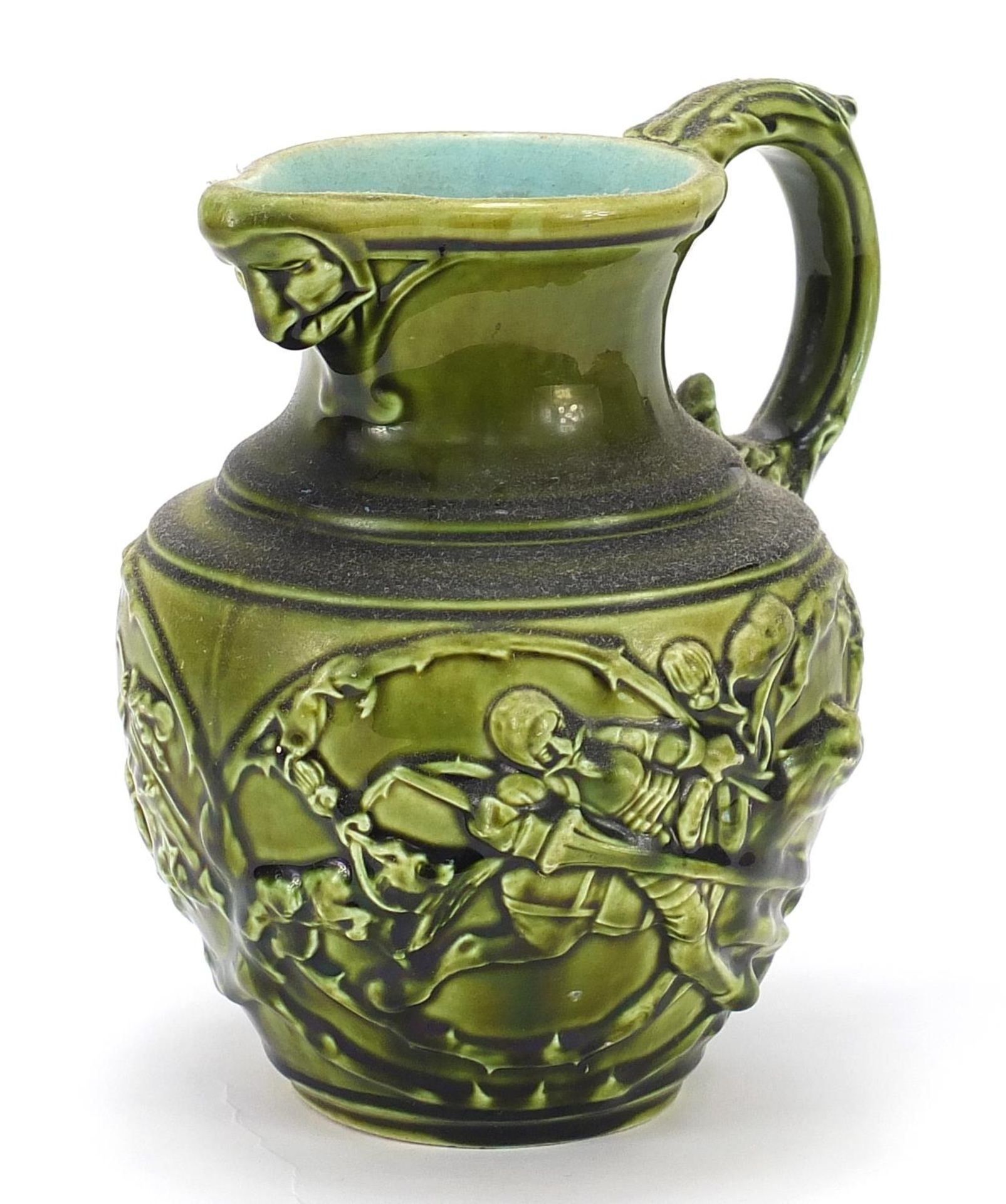 Sarreguemines, French Maiolica jug decorated in relief with figures, 18cm high : For Further