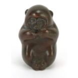 Japanese patinated bronze okimono of a monkey, character marks to the base, 4cm high : For Further