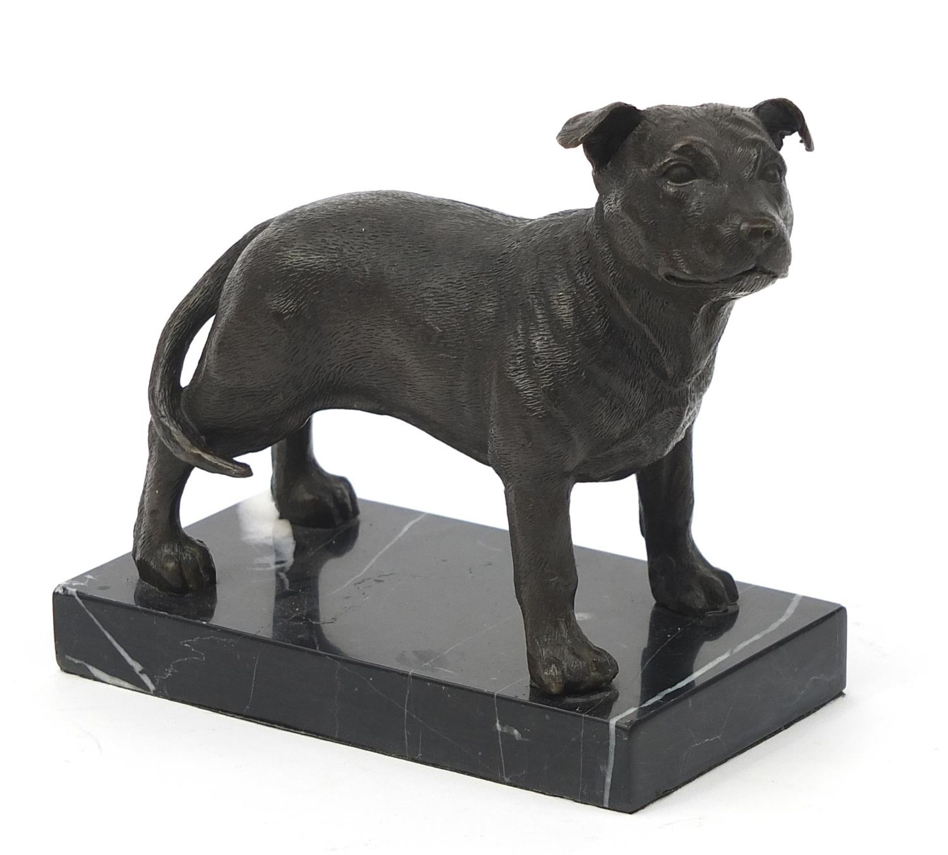 Patinated bronze study of a Staffordshire Bull Terrier raised on a faux marble base, 14cm in