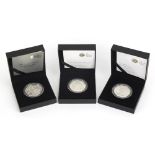 Three commemorative silver proof five pound coins by The Royal Mint with boxes and certificates