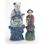 Two Chinese porcelain figures including one of a female holding flowers, the largest 31.5cm high :