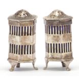 T H Hazelwood & Co, pair of George V silver hexagonal silver casters with blue glass liners,