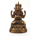 Chino-Tibetan partially gilt bronze jewelled figure of Buddha, 34.5cm high : For Further Condition