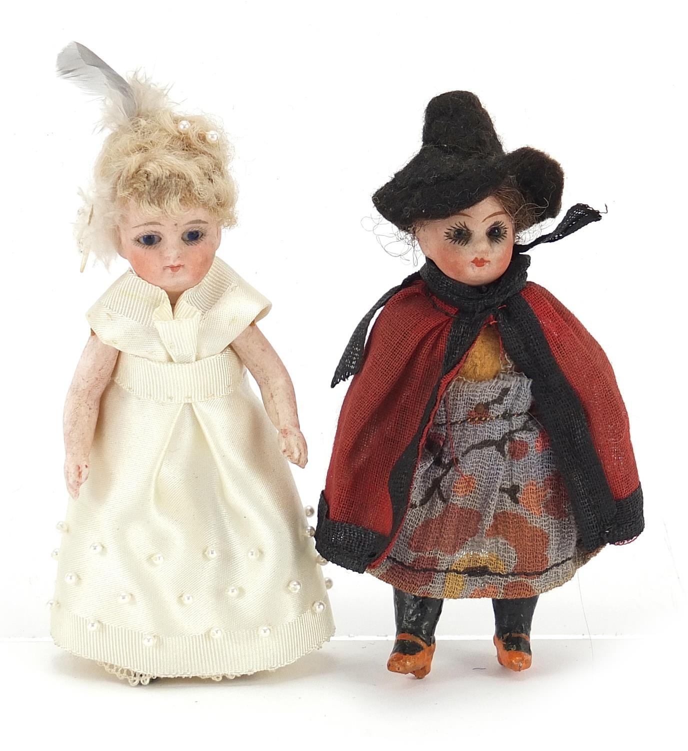 Two miniature bisque headed dolls with jointed limbs, each approximately 9cm high : For Further