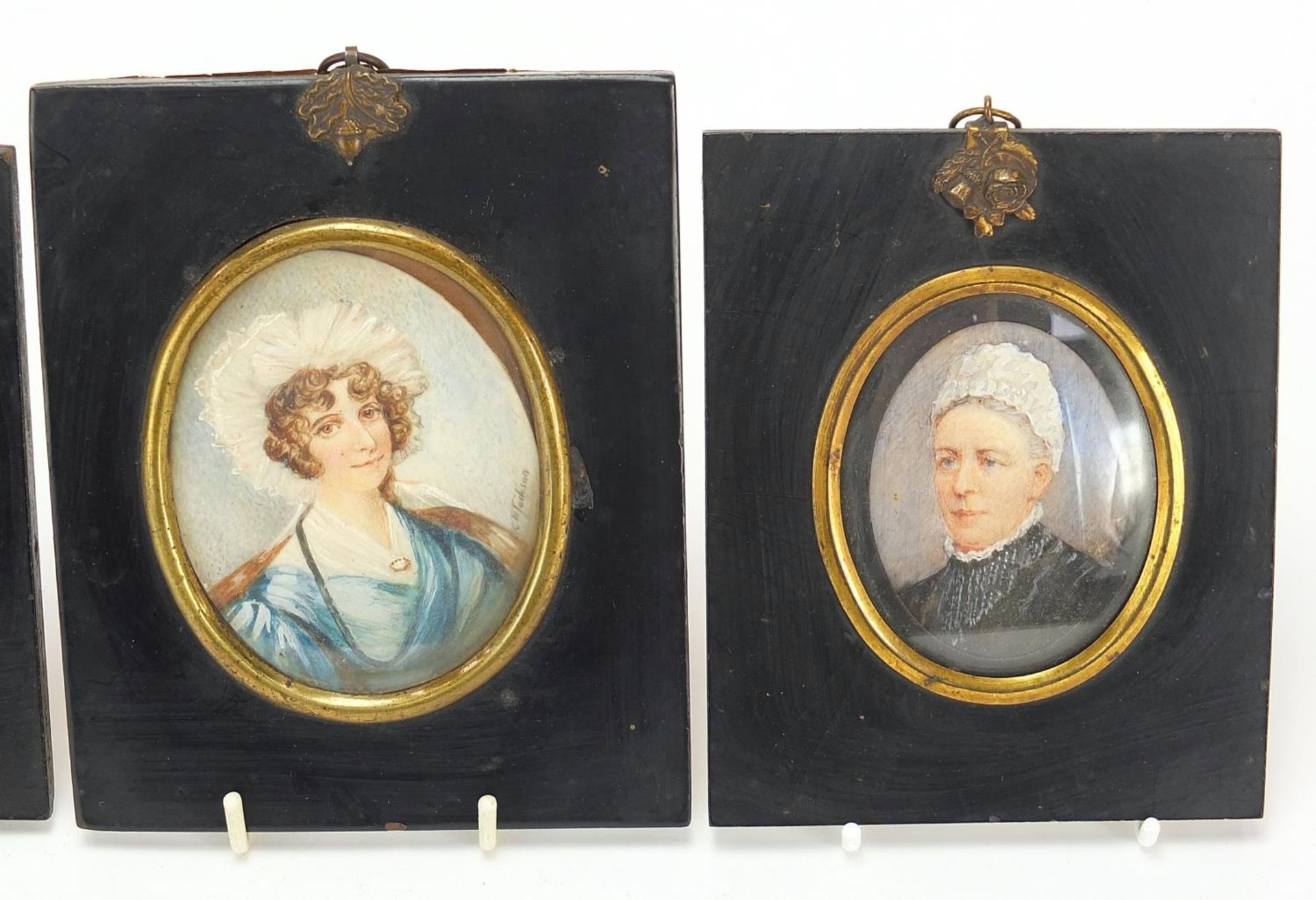 Four Victorian oval hand painted portrait miniatures, including one of a lady wearing a bonnet, - Image 3 of 6