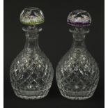 Two Whitefriars cut glass decanters with millefiori paperweight design stoppers, each with date