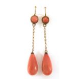 Pair of antique unmarked gold pink coral drop earrings, housed in a Reid & Sons tooled leather