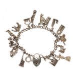 Silver charm bracelet with a selection of mostly silver charms, including London Bridge,