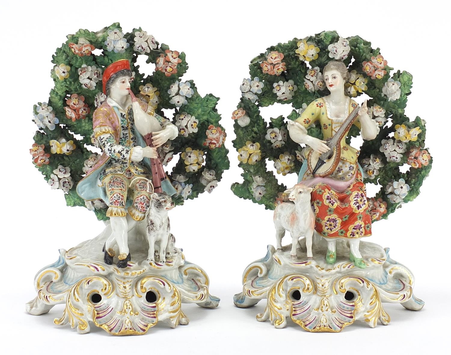 Pair of antique bocage groups modelled as male and female musicians in 18th century dress, both with