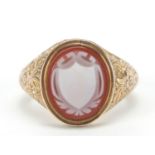 Victorian 9ct gold carnelian cameo seal ring with floral engraved shoulders, London 1862, size M/