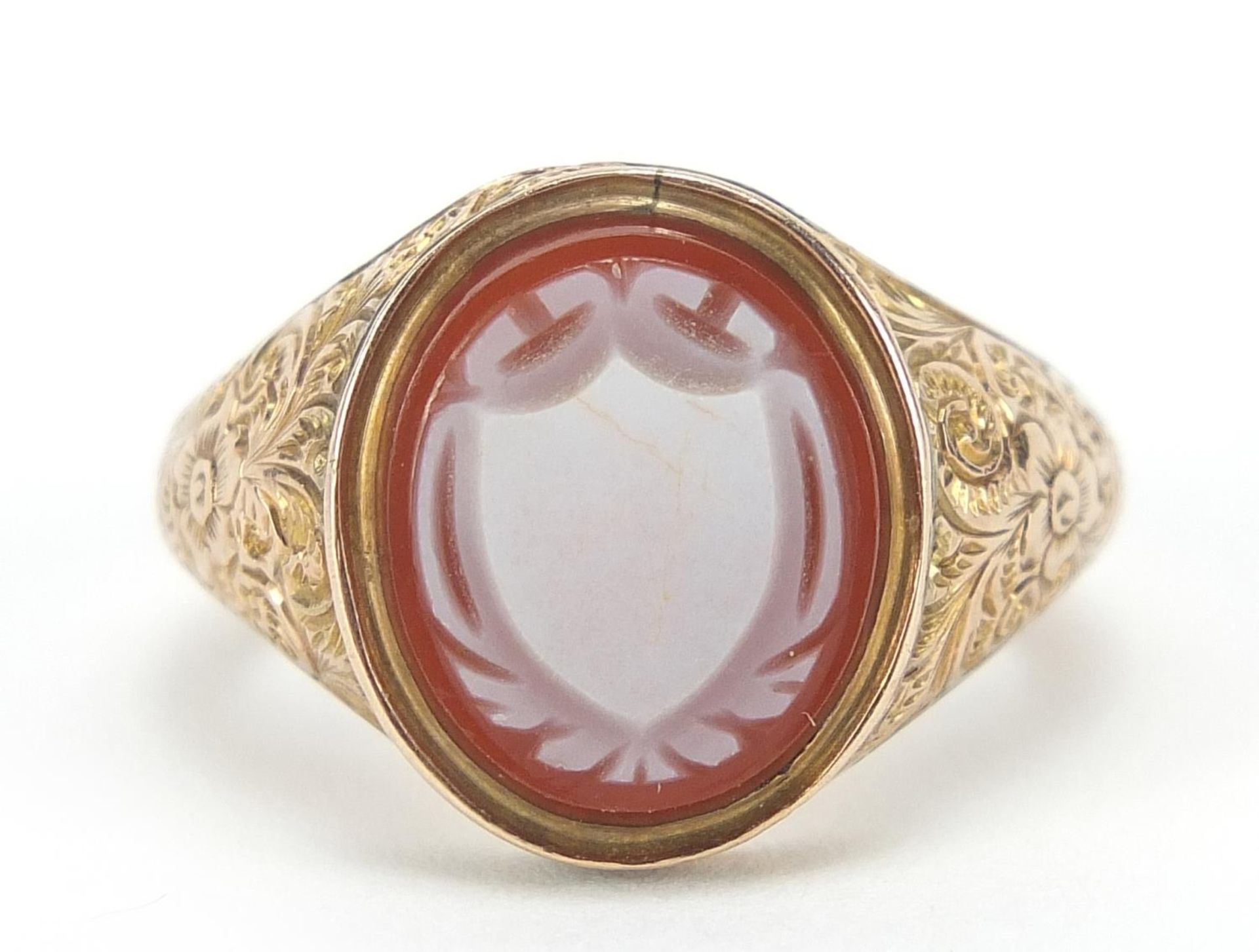 Victorian 9ct gold carnelian cameo seal ring with floral engraved shoulders, London 1862, size M/