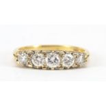 18ct gold diamond five stone ring, the centre diamond approximately 3.8mm in diameter, size N, 4.