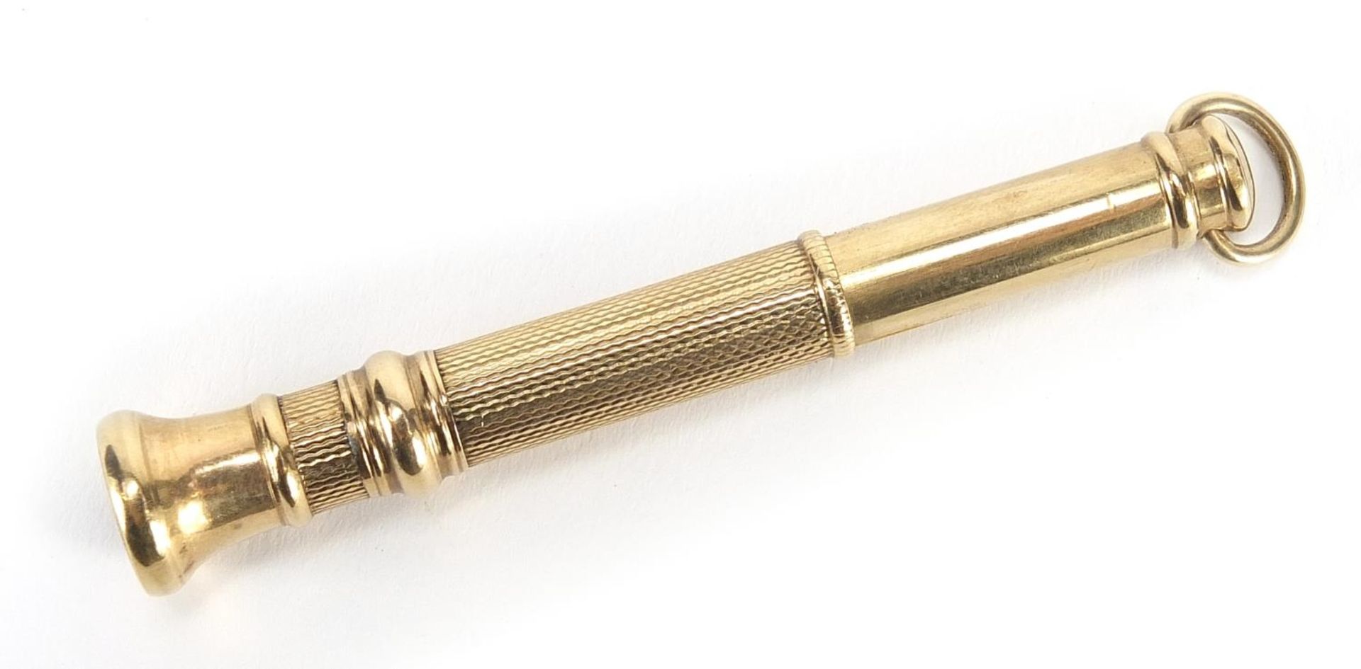 9ct gold cigar pricker with engine turned decoration, Birmingham 1941, 6.5cm in length, 7.2g : For