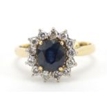 18ct gold sapphire and diamond flower head ring, the sapphire approximately 6.4mm x 5.8mm, altered