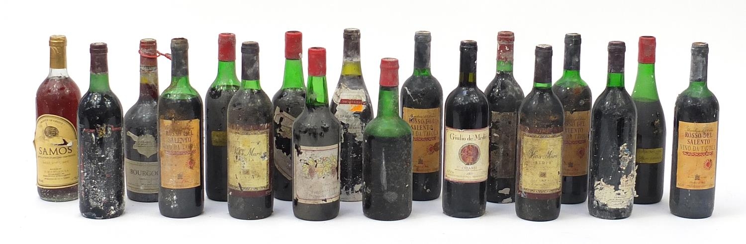 Eighteen vintage bottles of red wine, most with remnants of paper labels : For Further Condition