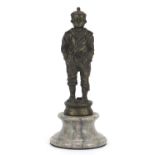 Patinated bronzed figure of a young sailor raised on a circular marble base, 24cm high : For Further
