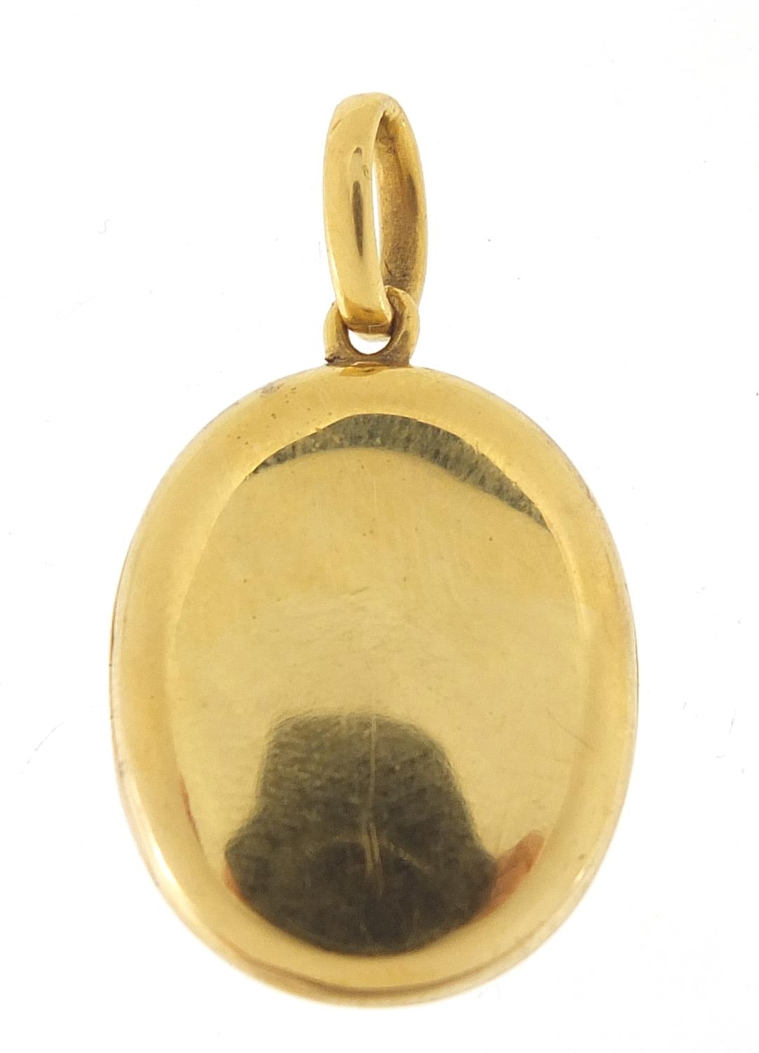 18ct gold oval locket, 3.5cm high, 8.2g : For Further Condition Reports Please Visit Our Website -