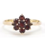 9ct gold garnet flower head ring, size O, 1.6g : For Further Condition Reports Please Visit Our