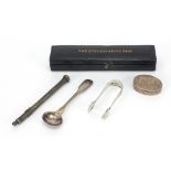 Silver objects comprising Georgian mustard spoon, sugar tongs, pill box and silver coloured metal