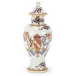 Samson porcelain baluster vase and cover hand painted with flowers and armorial crest, 14.5cm high :