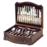 Viner's six place mahogany canteen of silver plated cutlery with serpentine outline, 38.5cm wide :