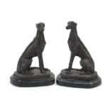 Patinated bronze greyhounds raised on shaped marble bases signed Barrie, each 20cm high : For