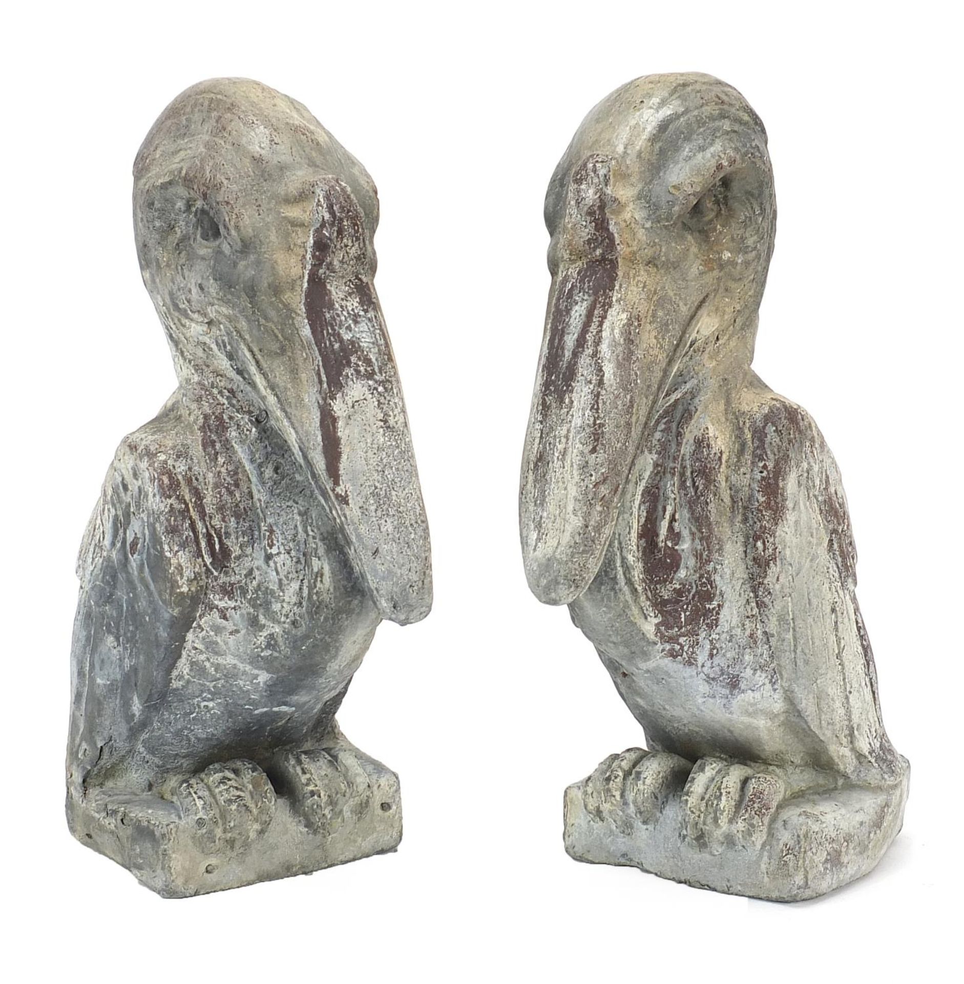 Two garden lead ornaments in the form of pelicans, each 36.5cm high : For Further Condition