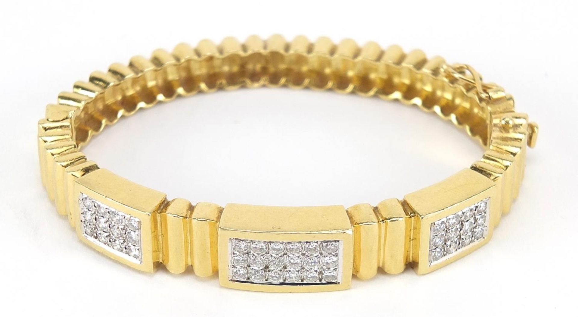 18ct gold diamond cluster hinged bangle, set with forty two diamonds the diamonds approximately 2. - Image 2 of 7