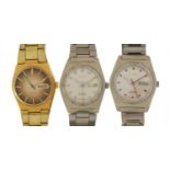 Imado, three gentlemen's automatic day date wristwatches : For Further Condition Reports Please