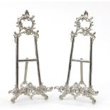 Pair of silvered metal Rococo style easel stands, 40cm high : For Further Condition Reports Please
